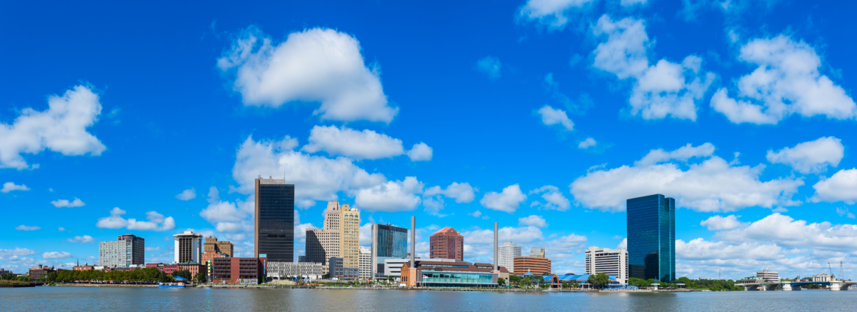 Panoramic view of Toledo downtown skyline with blue sky and white clouds, Ohio