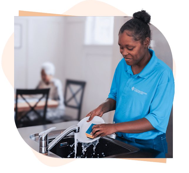 Caregiver washing dishes